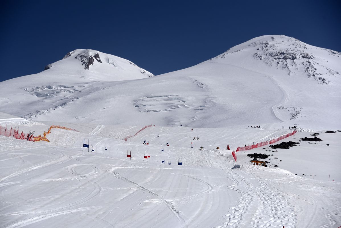 14A Skiers With Mount Elbrus West And East Summits Morning From Garabashi Camp On Mount Elbrus Climb